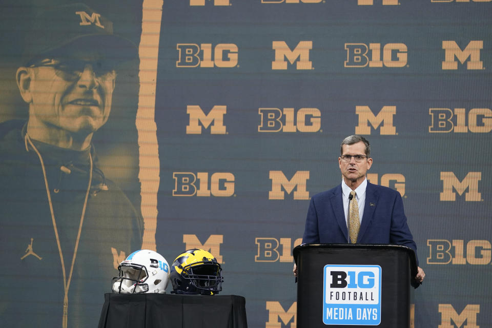 Michigan head coach Jim Harbaugh talks to reporters during an NCAA college football news conference at the Big Ten Conference media days, at Lucas Oil Stadium, Tuesday, July 26, 2022, in Indianapolis. (AP Photo/Darron Cummings)