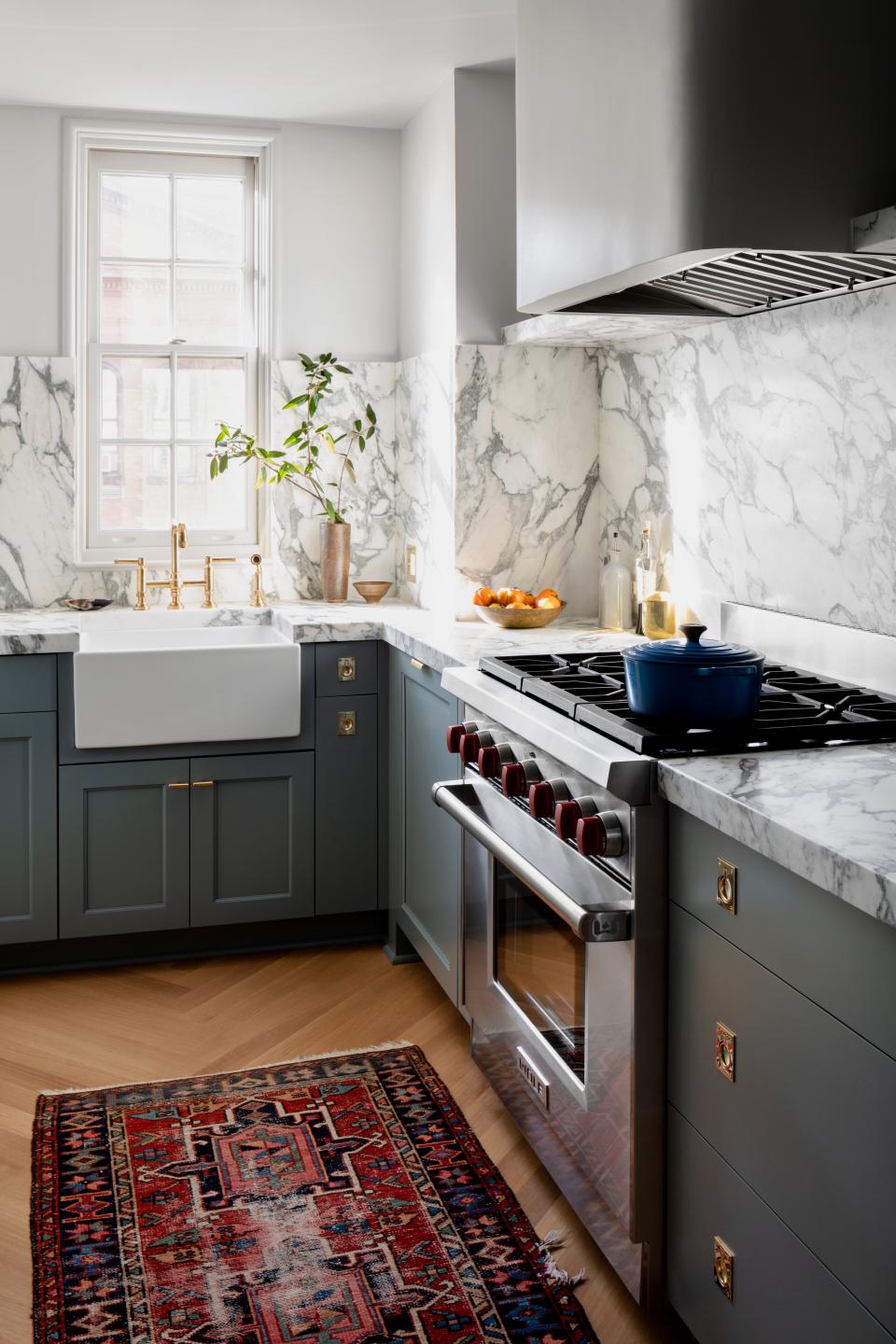 AFTER: “Storage was a challenge, especially in the kitchen,” Nicholas says. “But the small footprint was also an opportunity to play with scale, in order to make it feel bigger than it is.” Arabescato by ABC Stone was chosen for the countertops, with ring and hand pulls by P.E. Guerin. Shaws of Darwen supplied the sink, with fixtures by House of Rohl.