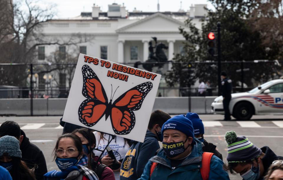 Activists and citizens with temporary protected status (TPS) march along 16th Street toward the White House in a call for Congress and the Biden administration to pass immigration reform legislation on February 23, 2021 in Washington, DC.  (Photo: ANDREW CABALLERO-REYNOLDS via Getty Images)