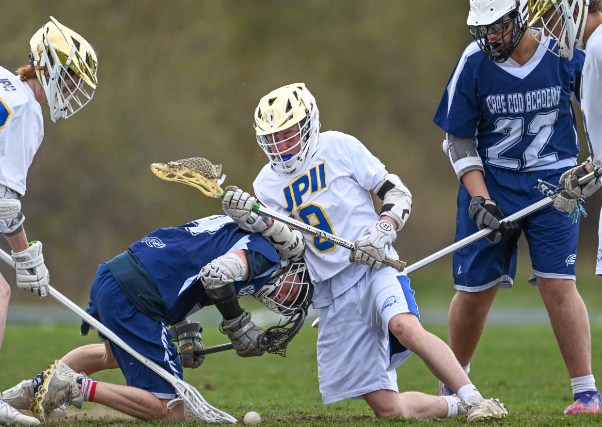 Brady Livingston of Cape Cod Academy and Alex Morin of St. John Paul II struggle for possession of the ball.