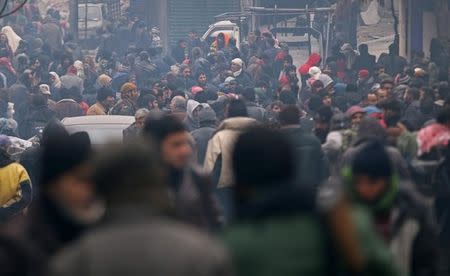 Rebel fighters and civilians wait to be evacuated from a rebel-held sector of eastern Aleppo, Syria December 17, 2016. REUTERS/Abdalrhman Ismail