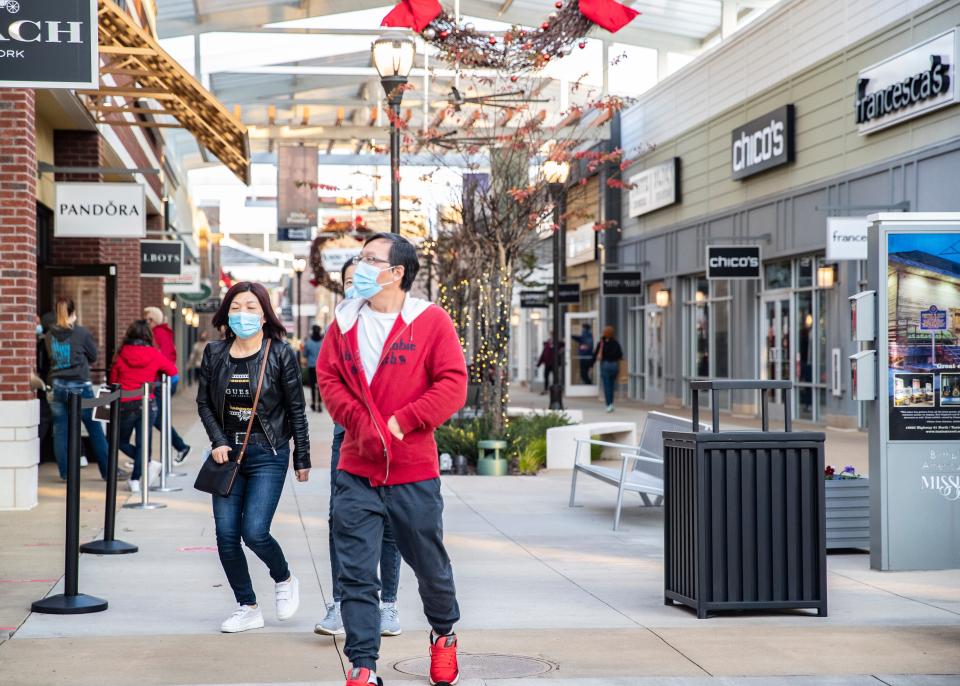 Black Friday shoppers shop at stores that opened at 6am at Tanger Outlets in Southaven, Miss., on Friday, November 27, 2020.