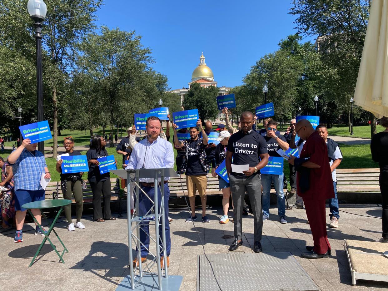 Conor Yunits, a spokesman for the Coalition for Independent Work, rallies supporters of a ballot measure that could decide the fate of app-based ride-share drivers in Massachusetts Wednesday.