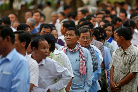 Commune counsellors line up to cast their vote in a Senate election in Takhmao, Kandal province, Cambodia February 25, 2018. REUTERS/Samrang Pring