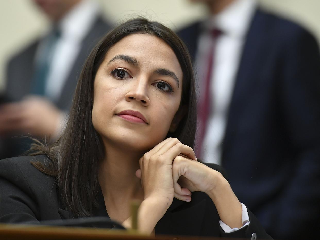 <p>Rep. Alexandria Ocasio-Cortez implied that her Republican colleague, Marjorie Taylor Greene, was trying to cut her workday short.</p> (AFP via Getty Images)