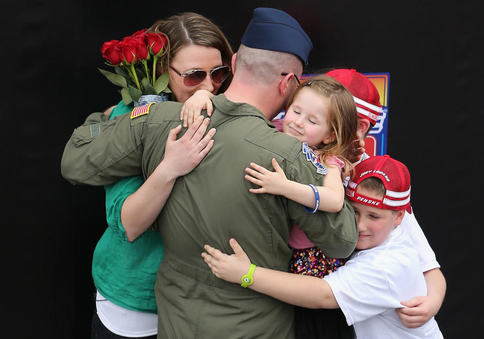 U.S. Air Force Technical Sergeant Chad Boley is reunited with his family at a surprise homecoming prior to the NASCAR Sprint Cup Series AdvoCare 500 at Phoenix International Raceway on Nov. 10, 2013, in Avondale, Arizona.