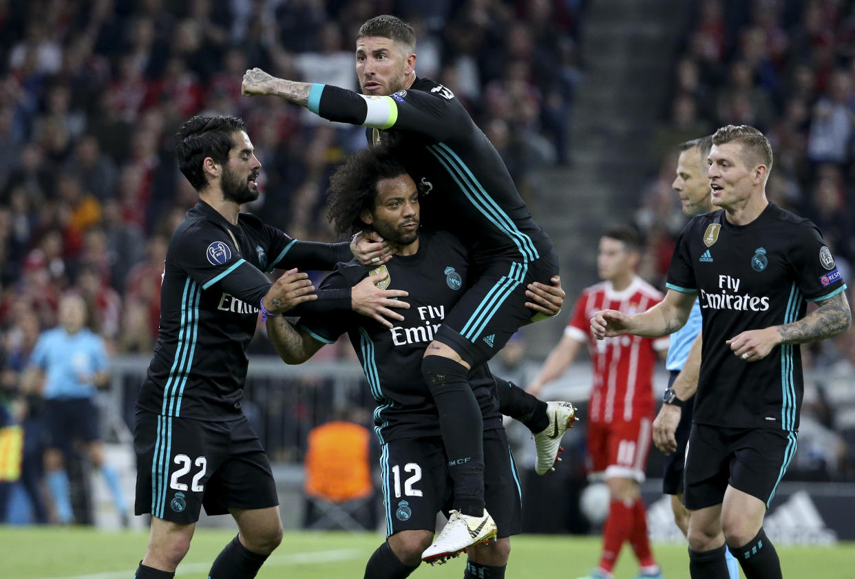 Real Madrid players celebrate Marcelo’s goal in the first half of their Champions League semifinal first leg against Bayern Munich. (Getty)