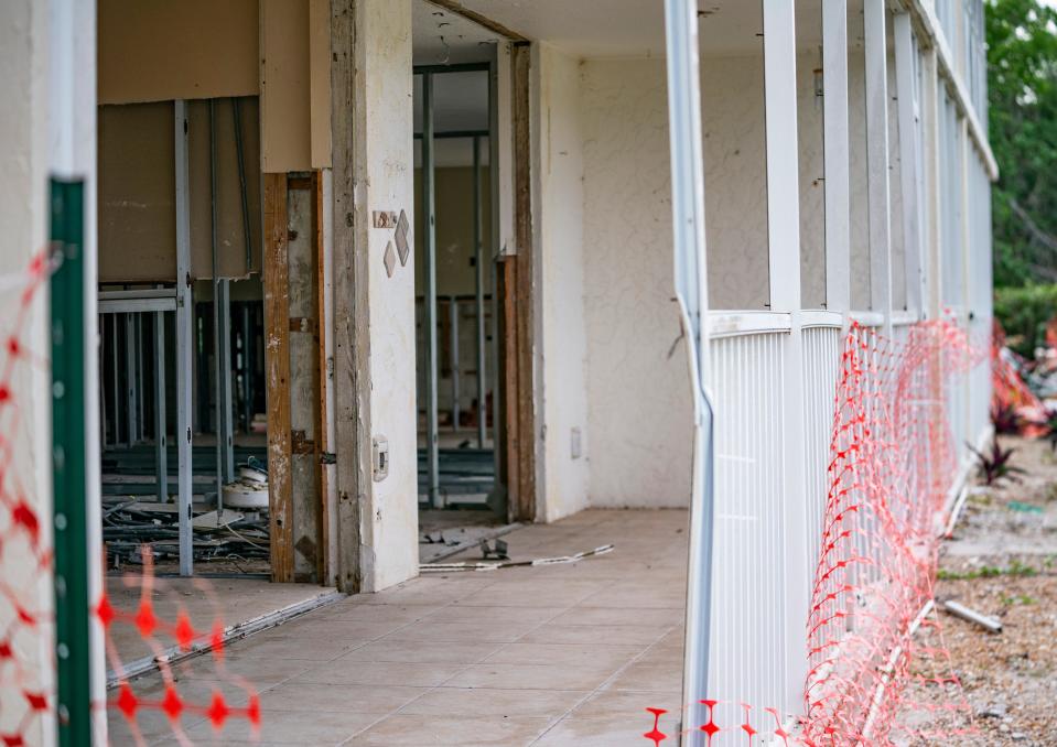 Damage from Hurricane Ian remains visible on the ground floor at the Vanderbilt III condominiums in Naples on Friday, Dec. 1, 2023. The units are still missing drywall and sliding glass doors.