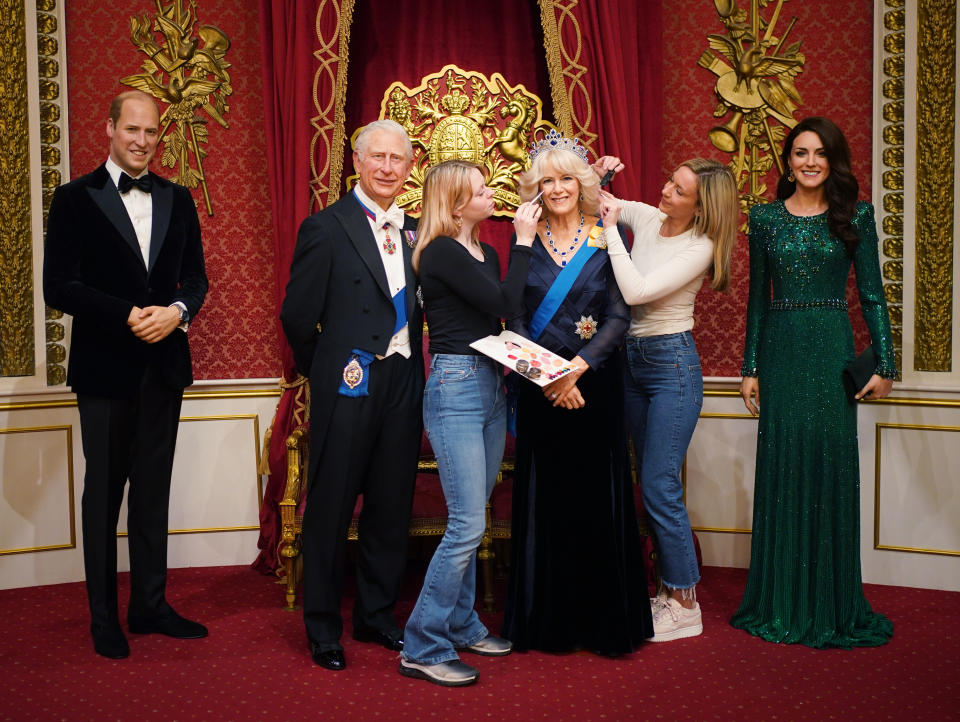 Studio artists Sophie Greenaway (left) and Claire Parkes add the finishing touches to a new Queen Consort wax figure at Madame Tussauds in London, ahead of the coronation of King Charles III on May 6. Picture date: Wednesday April 26, 2023. (Photo by Yui Mok/PA Images via Getty Images)