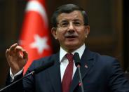 Turkish Prime Minister Ahmet Davutoglu delivers a speech on February 9, 2016 in Ankara