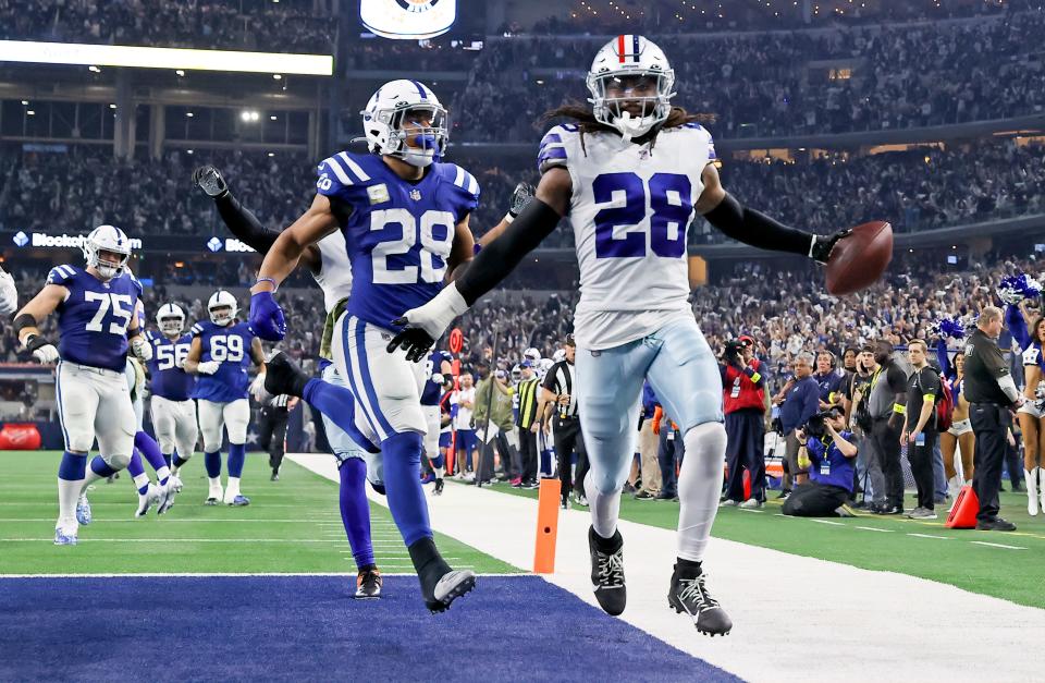 Dec 4, 2022; Arlington, Texas, USA;  Dallas Cowboys safety Malik Hooker (28) recovers a fumble and runs it back for a touchdown  during the fourth quarter against the Indianapolis Colts at AT&T Stadium.