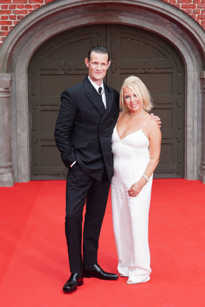 Matt with his arm around his mom on the red carpet