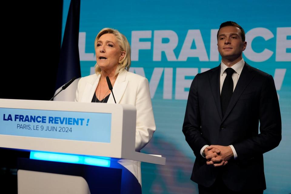 Marine Le Pen and Jordan Bardella in Paris on Sunday (AP)