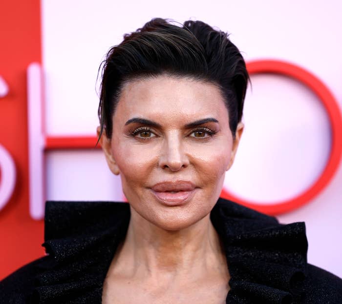 A closeup of Lisa Rinna who's hair is slicked back