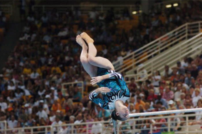 Lisa Skinner competing on the parallel bars in the women's team competition during the Olympics in Athens, Greece in 2004. Image: Getty