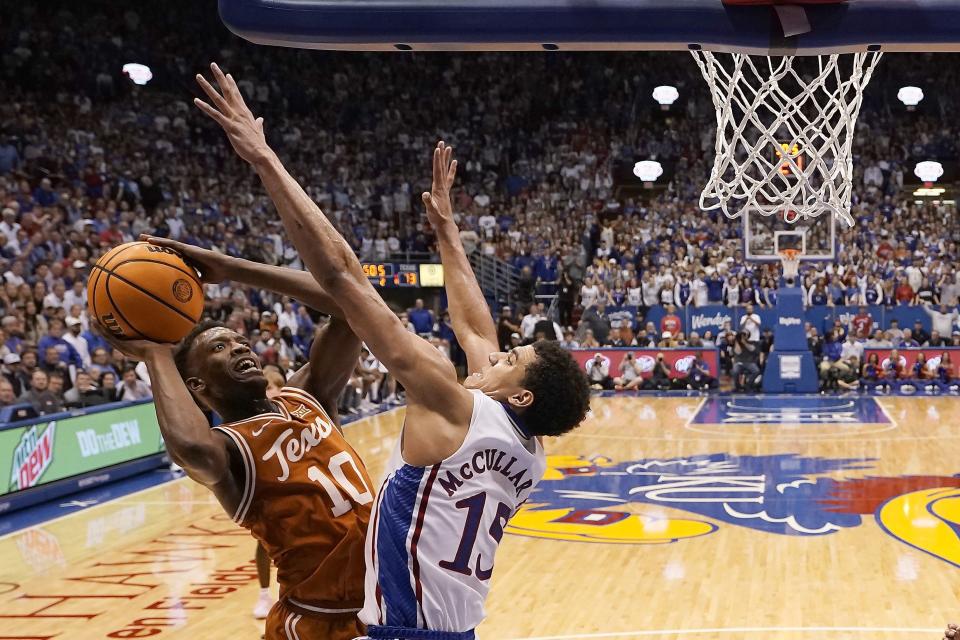 Texas guard Jabari Rice shoots under pressure from Kansas guard Kevin McCullar. "We kind of shot ourselves in the foot," UT guard Marcus Carr said. Carr finished with a game-high 29 points after scoring just seven with four turnovers in the first half.