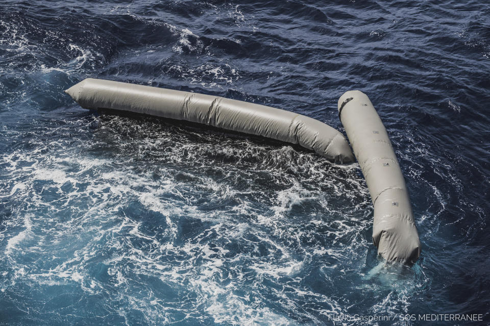 Debris from a dinghy which was supposedly carrying over 100 migrants are seen floating in the Mediterranean Sea northeast of the Libyan capital, Tripoli, Thursday, April 22, 2021. SOS Mediterranee, which operates the rescue vessel Ocean Viking, said late Thursday that the wreck of a rubber boat, which was initially carrying around 130 people, was spotted in the Mediterranean Sea. The aid vessel did not find any survivors, but could see at least ten bodies near the wreck, the group added in a statement. (Flavio Gasperini/SOS Mediterranee via AP)