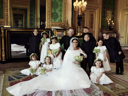 This official wedding photograph released by the Duke and Duchess of Sussex shows The Duke and Duchess in The Green Drawing Room, Windsor Castle, with (left-to-right): Back row: Master Brian Mulroney, Miss Remi Litt, Miss Rylan Litt, Master Jasper Dyer, Prince George, Miss Ivy Mulroney, Master John Mulroney. Front row: Miss Zalie Warren, Princess Charlotte, Miss Florence van Cutsem, May 19, 2018. Picture taken May 19, 2018. Alexi Lubomirski/Handout via Reuters