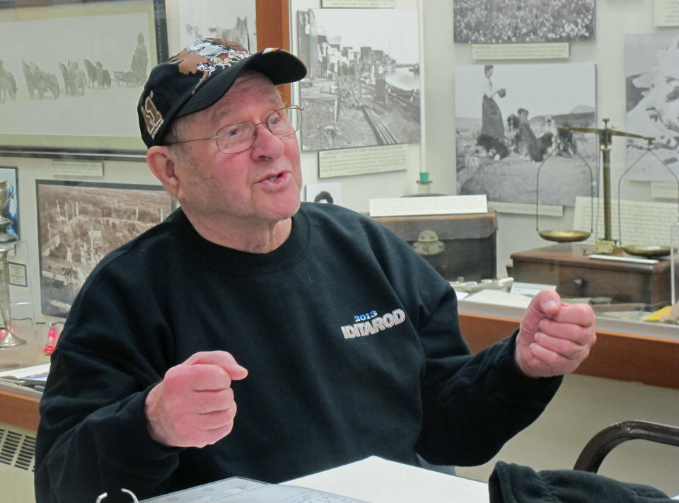 FILE - In this March 12, 2012, file photo, Howard Farley speaks about the history of the Iditarod Trail Sled Dog Race during a presentation at the Carrie M. McLain Memorial Museum in Nome, Alaska. Farley, 80, was a co-founder of the Iditarod race, organizing the Nome portion of the race at the finish. If you want to see mushers cross the finish line at the world's most famous sled dog race in March 2014, better make your reservations soon. There aren’t many hotel rooms available at the end of the Iditarod Trail Sled Dog Race in Nome, leaving mushers and their families battling with fans, tourists and volunteers for a place to sleep. (AP Photo/Mark Thiessen, file)