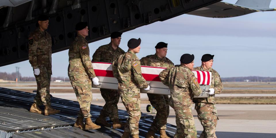 FILE - In this Dec. 25, 2019, file photo, an Army carry team moves a transfer case containing the remains of U.S. Army Sgt. 1st Class Michael Goble, at Dover Air Force Base, Del.. Goble, a U.S. Special Forces soldier who died in Afghanistan this week, was seizing a Taliban weapons cache when he was killed, the U.S. military said Friday. (AP Photo/Alex Brandon, File)