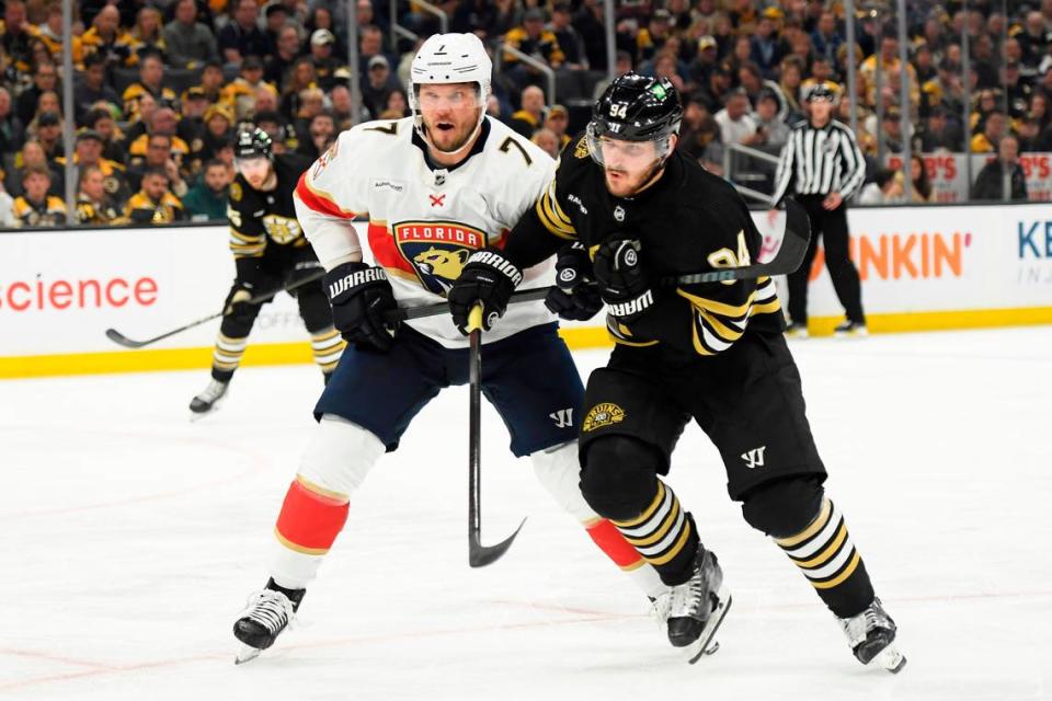 May 12, 2024; Boston, Massachusetts, USA; Florida Panthers defenseman Dmitry Kulikov (7) and Boston Bruins center Jakub Lauko (94) battle during the third period in game four of the second round of the 2024 Stanley Cup Playoffs at TD Garden.