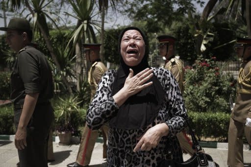 An Egyptian relative of Samir Anwar Ismail, a member of special forces who was killed in clashes between troops and anti-military protesters the previous day, mourns during his funeral in Cairo on May 5