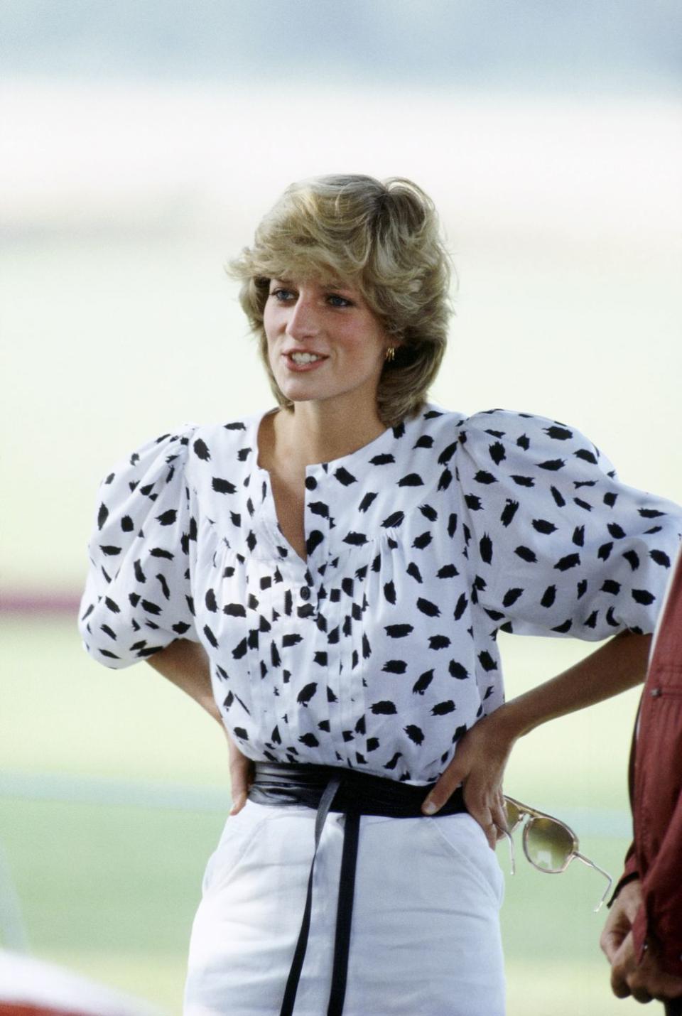 <p>Puffy shoulders are adorning plenty of tops and dresses this season – and, typically, it's a trend that Princess Diana mastered first. This black-and-white printed number with white linen trousers that she wore to a polo match in 1985 is proof of that. Mimic her style with Cecilie Bahnsen's puffy-shouldered top – and make it work for winter by pairing with leather trousers and boots.</p>
