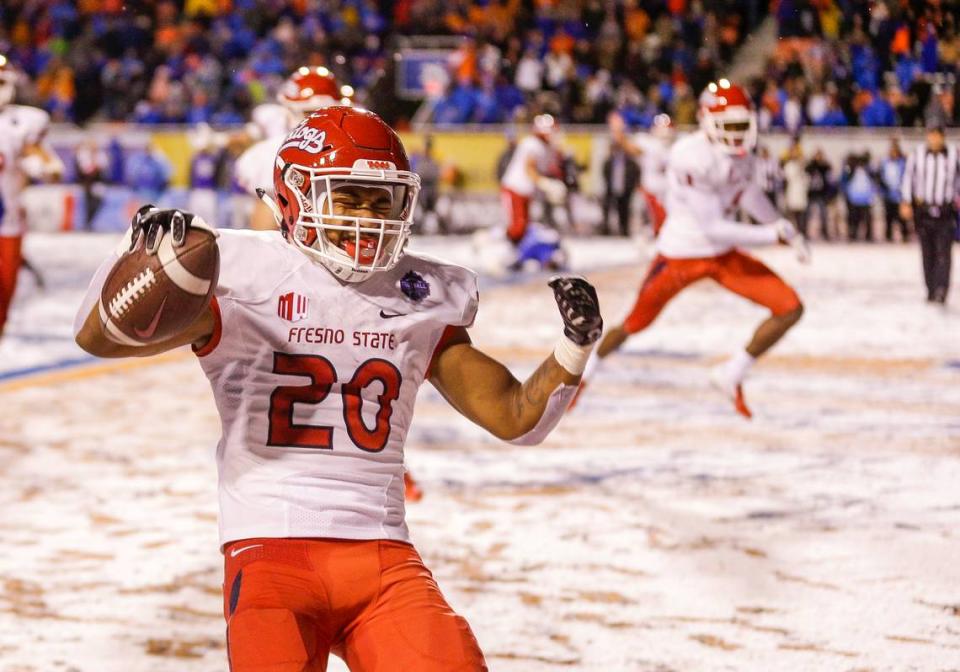 Fresno State running back Ronnie Rivers (20) celebrates the game winning touchdown against Boise State in overtime against in an NCAA college football game for the Mountain West championship, Saturday, Dec. 1, 2018, in Boise, Idaho. Fresno State won 19-16.