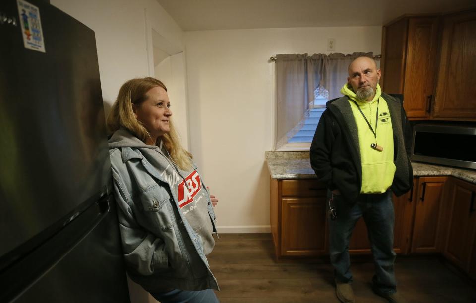 Christina Henry and Ronnie Johnston talk about trying to sell their old house in East Palestine. The couple now live four miles north of the village.