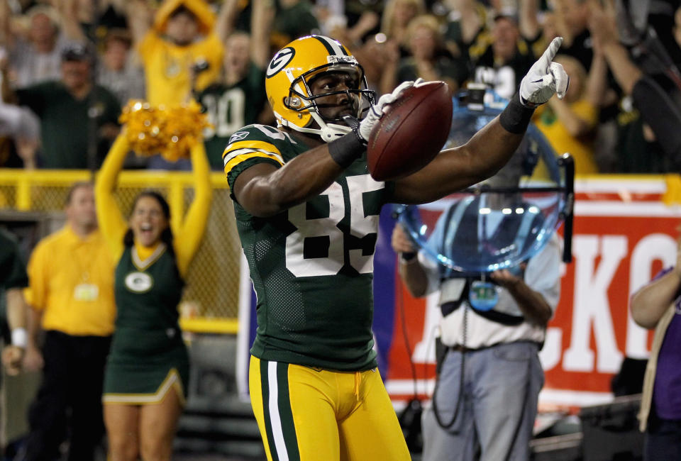 GREEN BAY, WI - SEPTEMBER 08: Greg Jennings #85 of the Green Bay Packers celebrates after scoring a touchdown in the first quarter against the New Orleans Saints during the season opening game at Lambeau Field on September 8, 2011 in Green Bay, Wisconsin. (Photo by Jonathan Daniel/Getty Images)