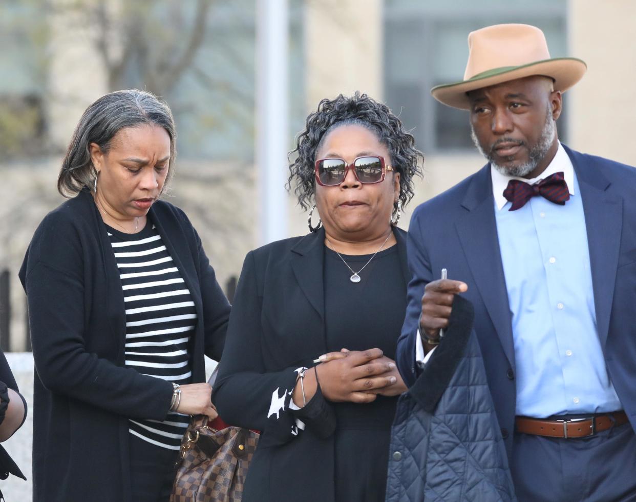 Andrea Ayers of Mount Vernon, center, walks out of the federal courthouse in White Plains April 26, 2024, after being sentenced in a pandemic relief fraud case. At right is her attorney Royce Russell.