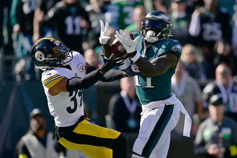 Philadelphia Eagles wide receiver A.J. Brown (11) catches a touchdown pass while being defended by Pittsburgh Steelers safety Minkah Fitzpatrick (39) during the first half of an NFL football game between the Pittsburgh Steelers and Philadelphia Eagles, Sunday, Oct. 30, 2022, in Philadelphia.