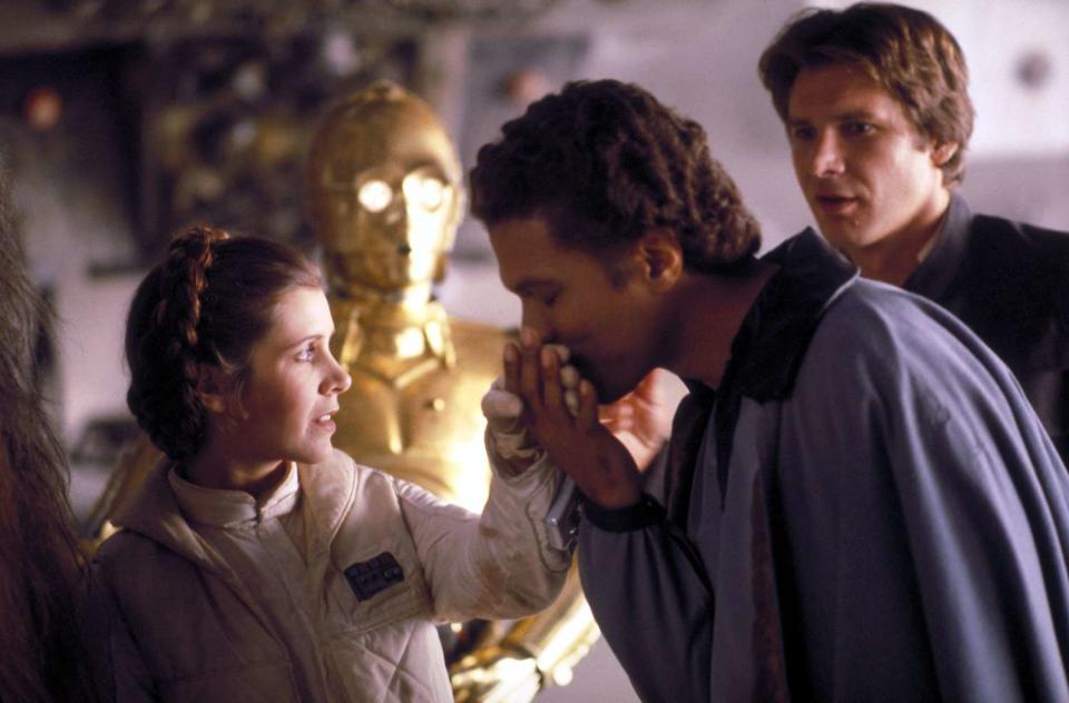 <p>Lucasfilm/Fox/Kobal/Shutterstock</p> Billy Dee Williams with Carrie Fisher and Harrison Ford 