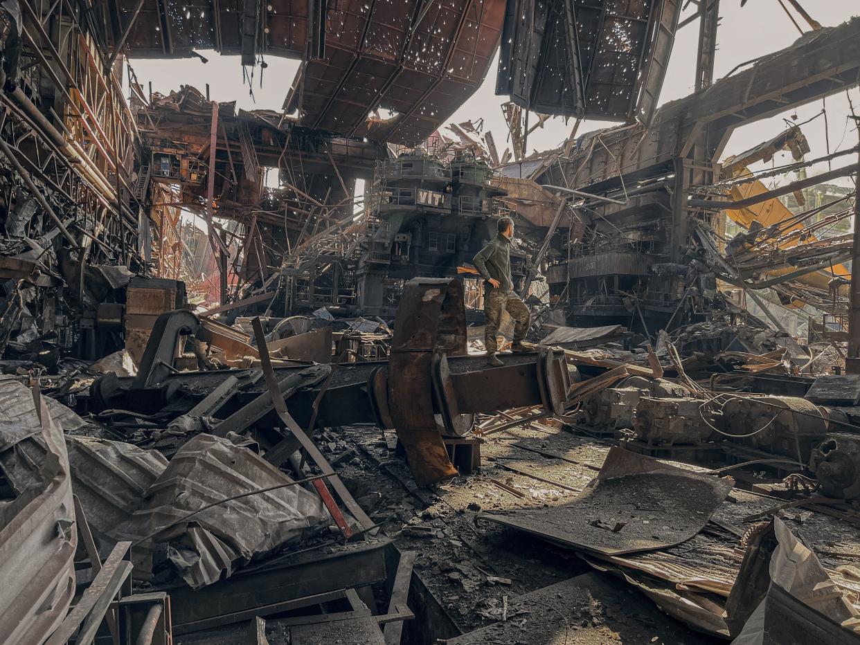 In this photo provided by Azov Special Forces Regiment of the Ukrainian National Guard Press Office, a Ukrainian soldier stands inside the ruined Azovstal steel plant prior to surrender to the Russian forces in Mariupol, Ukraine, on May 16y.(Dmytro Kozatski/Azov Special Forces Regiment of the Ukrainian National Guard Press Office via AP)