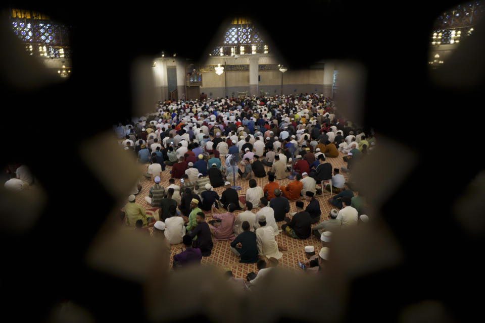 Muslims attend prayers at National Mosque for the Eid al-Fitr, marking the end the holy fasting month of Ramadan in Kuala Lumpur, Malaysia, Wednesday, April 10, 2024. (AP Photo/Vincent Thian)