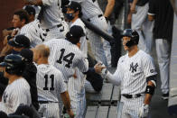 New York Yankees' Aaron Judge, right, celebrates with Tyler Wade (14) in the dugout after hitting a solo home run off Boston Red Sox starting pitcher Zack Godley during the first inning of a baseball game Saturday, Aug. 1, 2020, in New York. (AP Photo/John Minchillo)