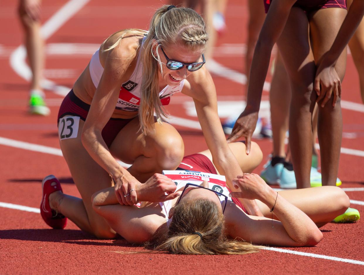 Karissa Schweizer, left, congratulates Elise Cranny after their second and first place finishes in the women's 5,000 meters on the final day of the USA Track and Field Championships 2022 at Hayward Field in Eugene on Sunday.