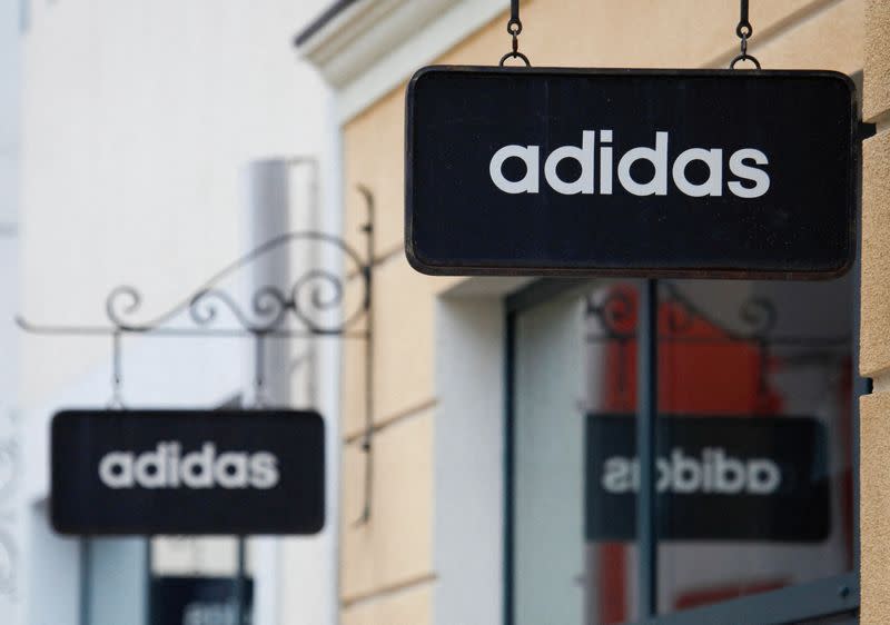 FILE PHOTO: Boards with Adidas store logo are seen on a shopping center at the outlet village Belaya Dacha outside Moscow