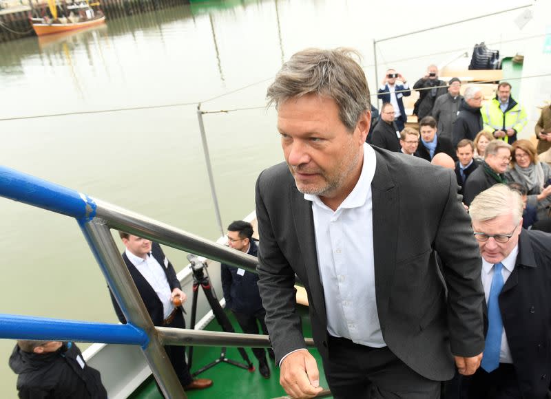 German Economy and Climate Protection Minister Robert Habeck enters a ship during a ceremony for a planned floating LNG terminal in the harbour in Wilhelmshaven