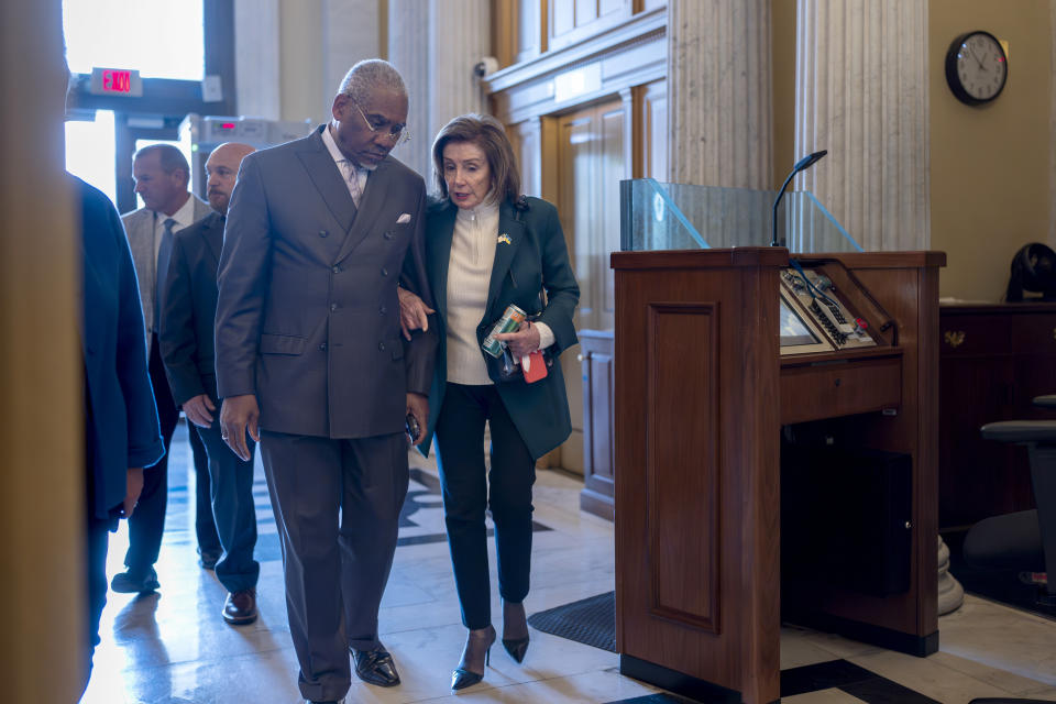 Rep. Gregory Meeks, D-N.Y., the ranking member of the House Foreign Affairs Committee, left, walks with Rep. Nancy Pelosi, D-Calif., the speaker emerita, as lawmakers arrive to vote on approval of $95 billion in foreign aid for Ukraine, Israel and other U.S. allies. (AP Photo/J. Scott Applewhite)