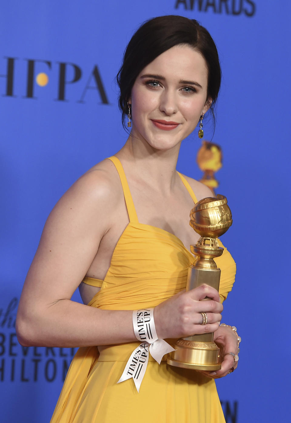 FILE - Rachel Brosnahan wears a Time's Up ribbon as she poses in the press room with the award for best performance by an actress in a television series, musical or comedy for "The Marvelous Mrs. Maisel" at the 76th annual Golden Globe Awards at the Beverly Hilton Hotel on Jan. 6, 2019, in Beverly Hills, Calif. Five years after making its public debut, the #MeToo-era's Time's Up organization is ceasing operations and shifting funds to its legal defense fund, according to the group’s board chair in an interview with The Associated Press, Friday, Jan. 20, 2023. (Photo by Jordan Strauss/Invision/AP, File)