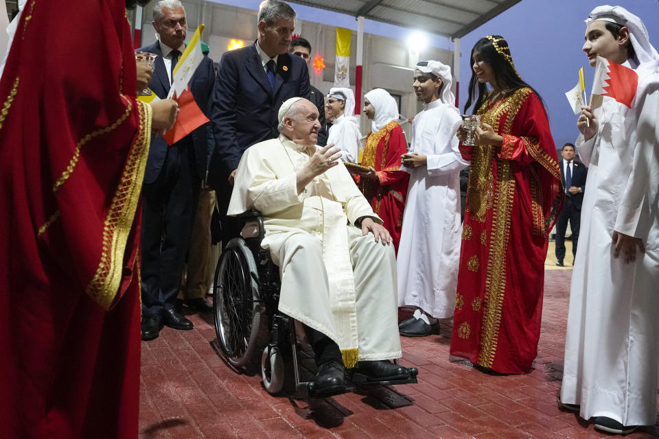 Pope Francis arrives for a meeting with the youth at the Sacred Heart School in Manama, Bahrain, Saturday, Nov. 5, 2022. Pope Francis is making the November 3-6 visit to participate in a government-sponsored conference on East-West dialogue and to minister to Bahrain's tiny Catholic community, part of his effort to pursue dialogue with the Muslim world. (AP Photo/Alessandra Tarantino)