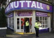 Police officers leave the vandalised UKIP campaign office after their leader Paul Nuttall lost the Stoke Central by-election in Stoke on Trent, February 24, 2017. REUTERS/Darren Staples