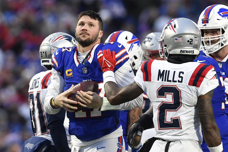 Buffalo Bills quarterback Josh Allen (17) looks at the scoreboard as time runs out during the second half of an NFL football game against the New England Patriots in Orchard Park, N.Y., Sunday, Dec. 31, 2023. (AP Photo/Adrian Kraus)