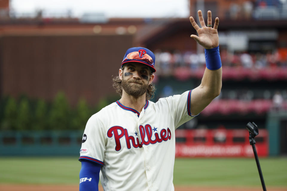 Philadelphia Phillies' Bryce Harper waves before addressing the crowd at Citizens Bank Park before a baseball game against the Miami Marlins, Sunday, Sept. 29, 2019, in Philadelphia. (AP Photo/Matt Slocum)