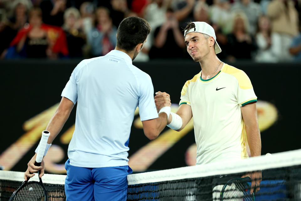 Dino Prizmic (圖右)澳網首輪對上Novak Djokovic。(Photo by Julian Finney/Getty Images)