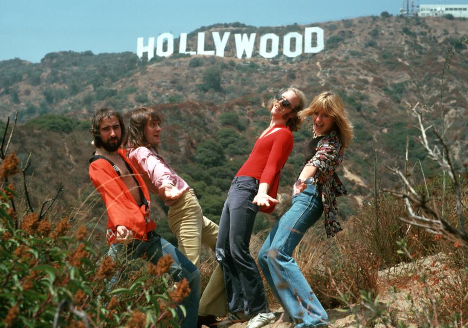 (L-R) John McVie, Mick Fleetwood, Bob Welch and Christine McVie of the rock group "Fleetwood Mac" pose for a portrait under the Hollywood Sign in August 1974 in Los Angeles, California.