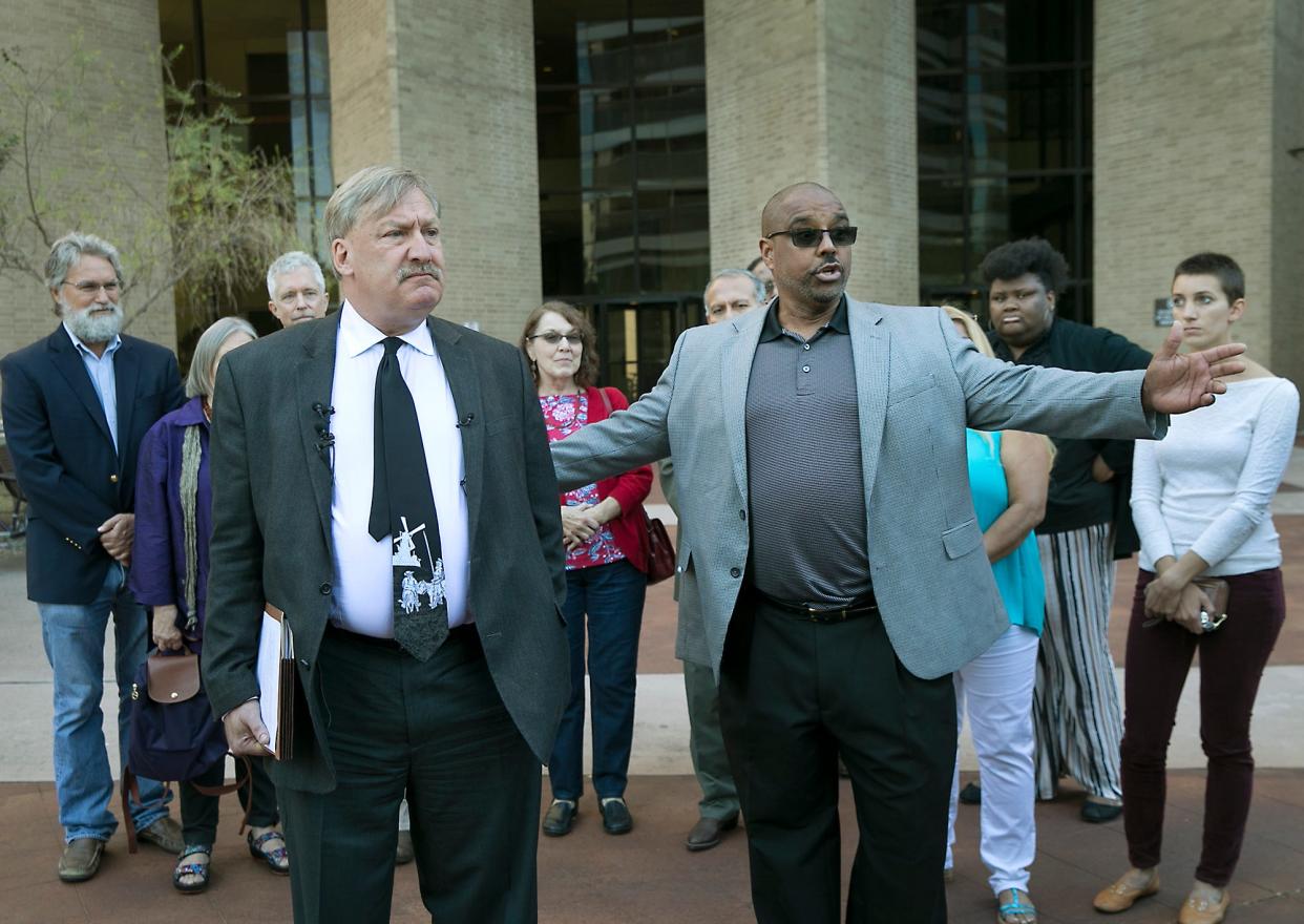 In 2017, a group of local residents, including plaintiff Richard Franklin III, right, filed a lawsuit asking a judge to require Central Health to spend its money only on indigent health care and not the $35 million a year it gives to Dell Medical School. Local attorney Fred Lewis, left, and the parties finally were in court Thursday.