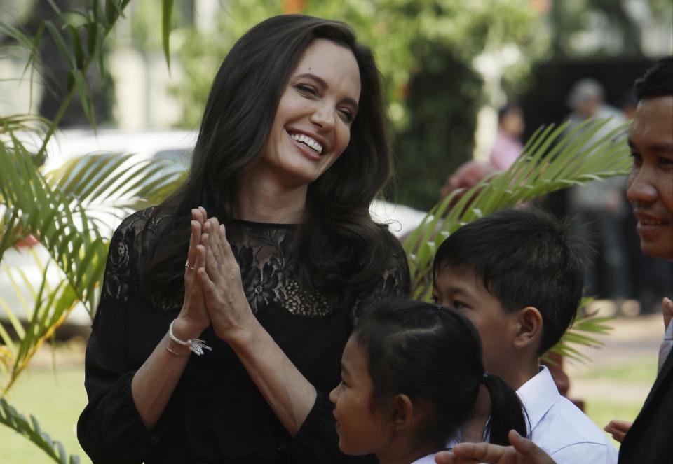 Hollywood actress Angelina Jolie smiles before a press conference in Siem Reap province, Cambodia, Saturday, Feb. 18, 2017. Jolie on Saturday launches her two-day film screening of "First They Killed My Father" in Angkor complex in Siem Reap province. (AP Photo/Heng Sinith)