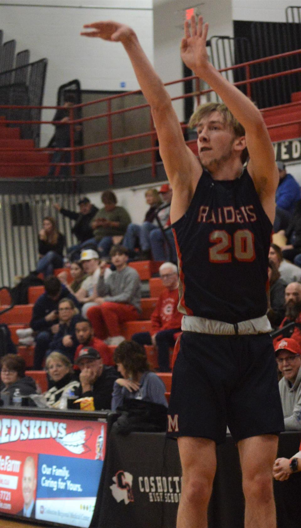 Morgan's Carson Mummey shoots a 3 in the second quarter of Friday's game at Coshocton. The Raiders won 83-68.